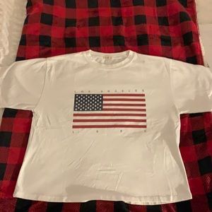 White John galt t shirt with flag and wording “ Los Angeles 1984” no stains/hole